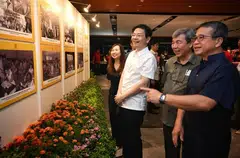 Prime Minister Lawrence Wong and Minister of Culture, Community and Youth Edwin Tong (right) viewing a photo exhibition of the Community Clubs from yesteryears on Nov 4. 