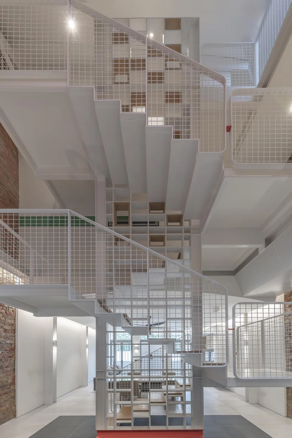 A new steel staircase rises up the house's centre.