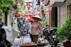 A street vendor in Hanoi, Vietnam. The country is the only economy that saw an improvement in its 2025 growth forecast to 7% from Amro's earlier April forecast of 6.5%.