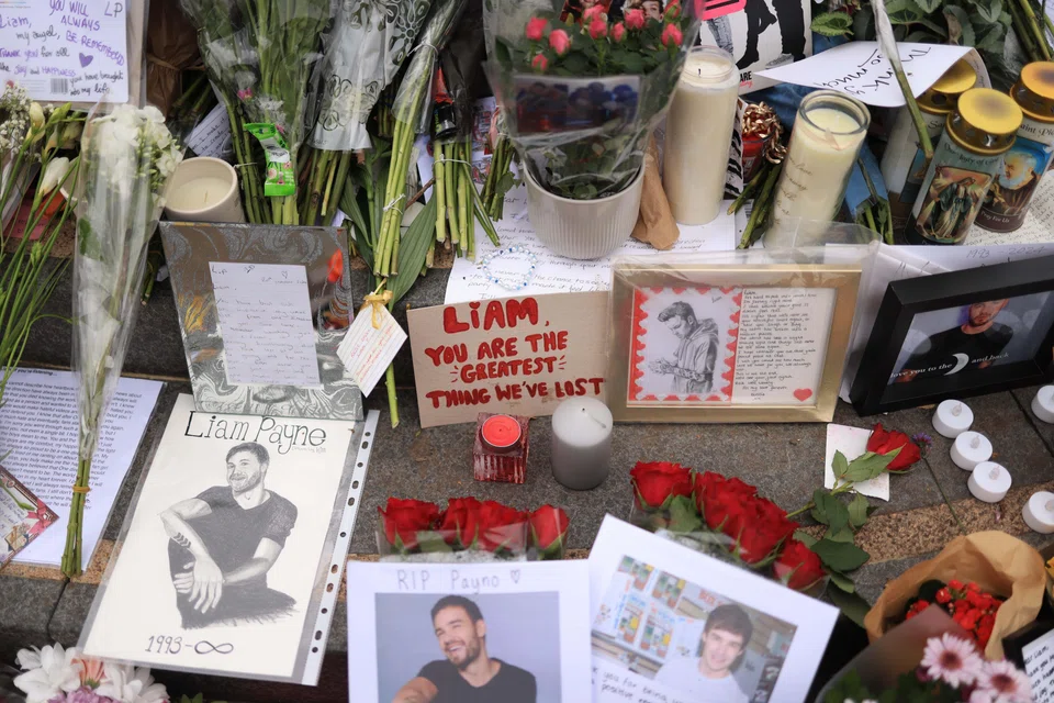 Tributes to One Direction singer Liam Payne at a statue of Peter Pan in Kensington Gardens in London, Britain,  Oct 21, 2024. Payne died on Oct 16 after falling from the balcony of his room at the Casa Sur hotel in centre Buenos Aires. 
