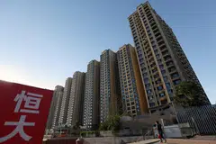 Evergrande’s downfall is by far the biggest in a crisis that dragged down China’s economic growth and led to a record number of distressed builders.