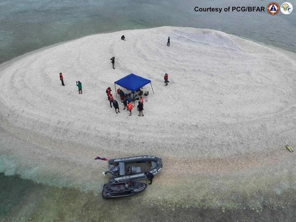 An aerial view of Philippine scientists inspecting Sandy Cay reef in March 2024. News reports of China seizing Sandy Cay were false as a Philippine team had visited the sandbars on Sunday and found nobody there.