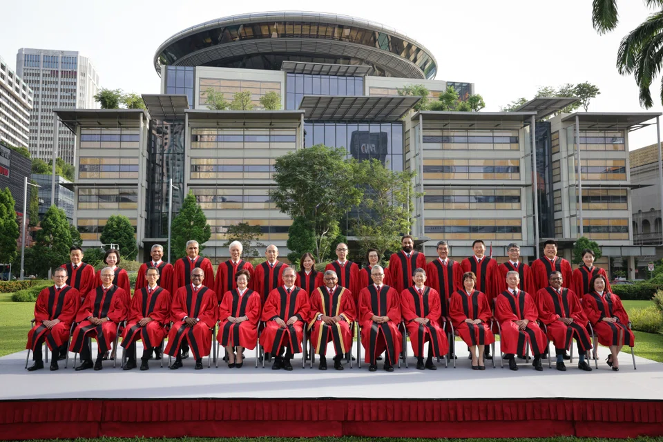 Chief Justice Sundaresh Menon (seated, seventh from left) says the  senior counsel appointment criteria are refined to ensure that the persons appointed would compare favourably with international counterparts.
