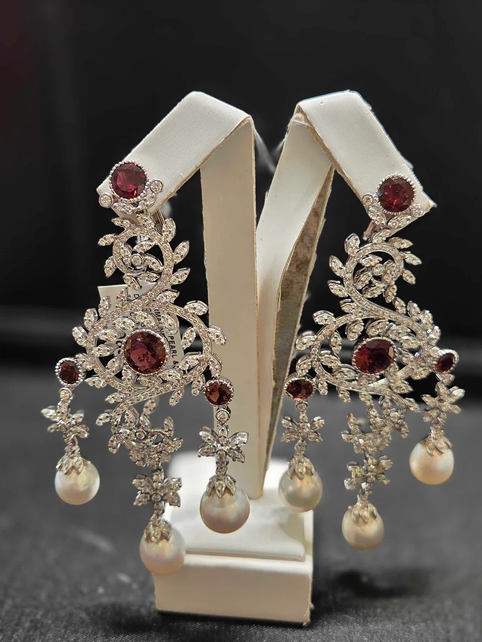Savvy consumers are turning to pre-loved jewellery for both adornment and investment. Above: A pair of chandelier earrings in white gold with diamonds, pearls and tourmalines from D'Lux Jewel, S$19,839. 