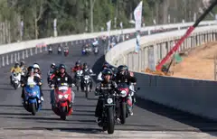 Indonesian President Joko Widodo (centre) riding a motorcycle during his visit to Nusantara in East Kalimantan.