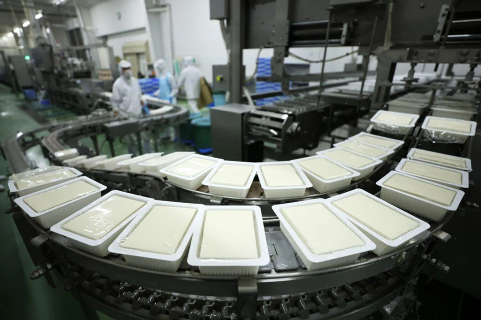 Packs of tofu moving on a production line at a factory in Japan. Going forward, supply chain management will increasingly focus on driving efficiency and reduction in waste. 