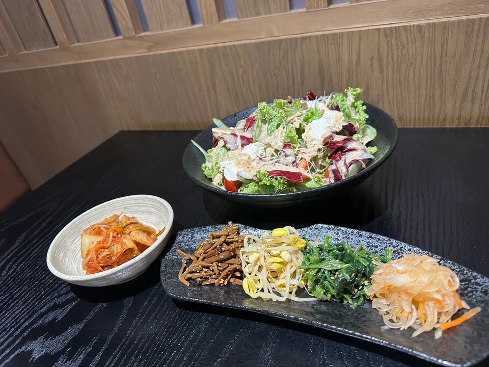 The house salad, kimchi and namul.