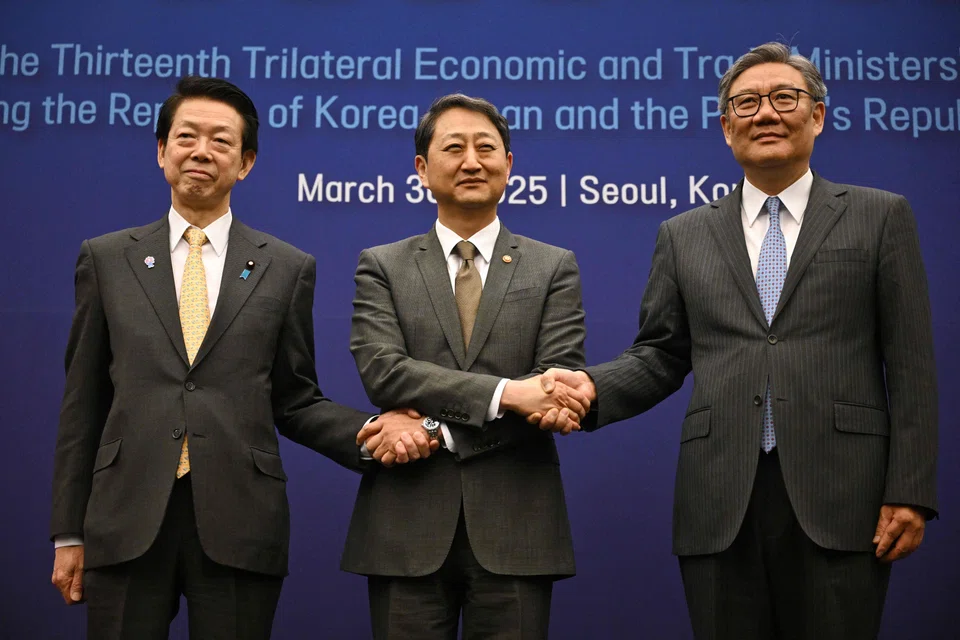 A Mar 30 meeting between South Korean Industry Minister Ahn Duk-geun (centre) and his counterparts, Yoji Muto of Japan (left) and Wang Wentao of China, takes place with the US’ 25% levy on car imports set to take effect on Apr 3.