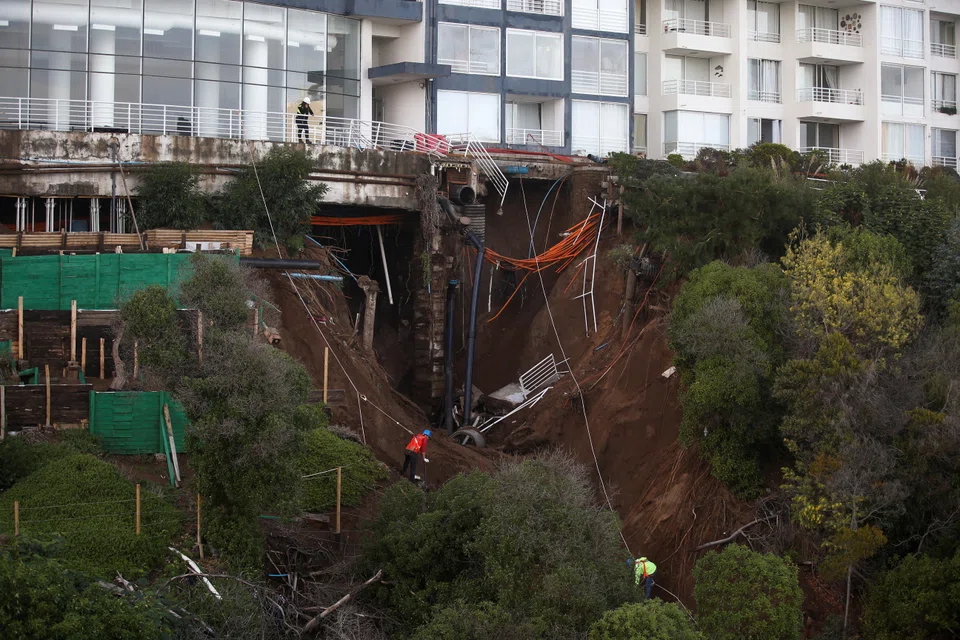 Intense rains that have lashed Chile in recent days caused a giant sinkhole to open underneath this high-end property in the resort city of Vina del Mar, prompting the evacuation of hundreds of residents.