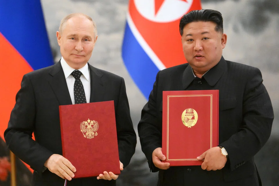 Russia's President Vladimir Putin and North Korea's leader Kim Jong Un pose for a photo during the signing ceremony of a “comprehensive strategic partnership” agreement.