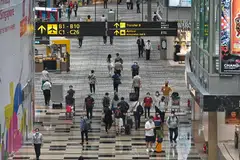 Travellers in the transit area at Changi Airport. As air travel with China is progressively restored, MOH will take a cautious approach towards increasing seat capacity on planes, taking into account the overall public health assessment.