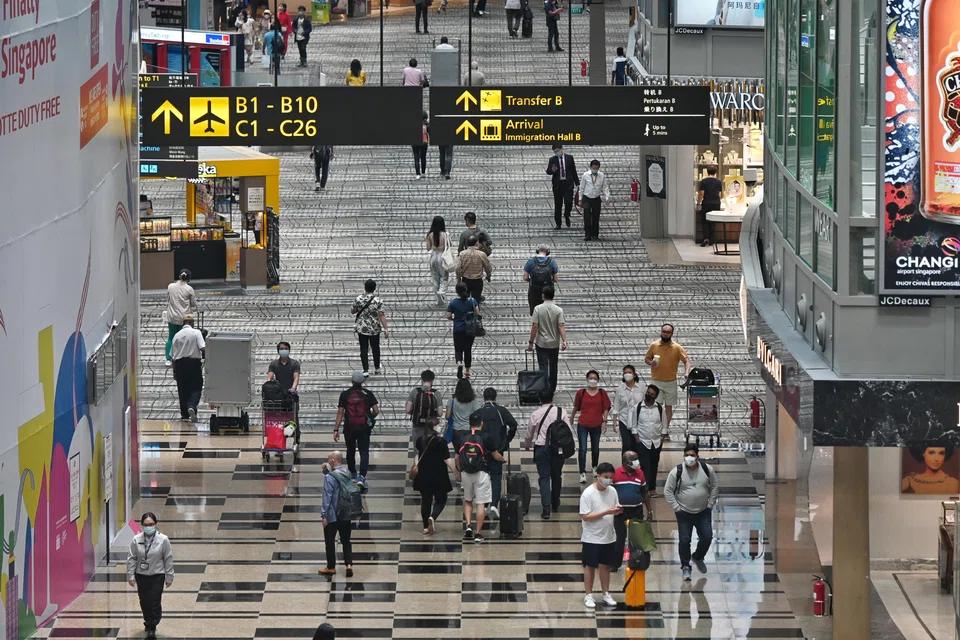 Travellers in the transit area at Changi Airport. As air travel with China is progressively restored, MOH will take a cautious approach towards increasing seat capacity on planes, taking into account the overall public health assessment.