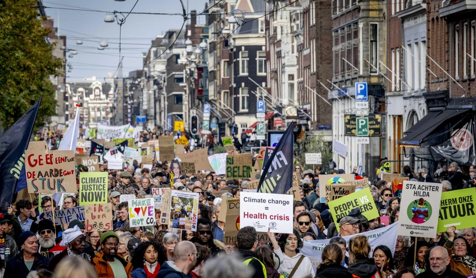 Activists in Amsterdam demanding action against climate change on Nov 12, ahead of the general election. The outcome of the Nov 22 election is highly uncertain, with three main party blocs seeking to make a breakthrough.