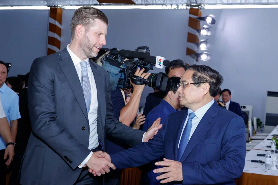Eric Trump (left), son of US President Donald Trump, shakes hands with Vietnam's Prime Minister Pham Minh Chinh (right) during the groundbreaking ceremony for the Trump International, Hung Yen resort and golf course project in Hung Yen province on May 21.