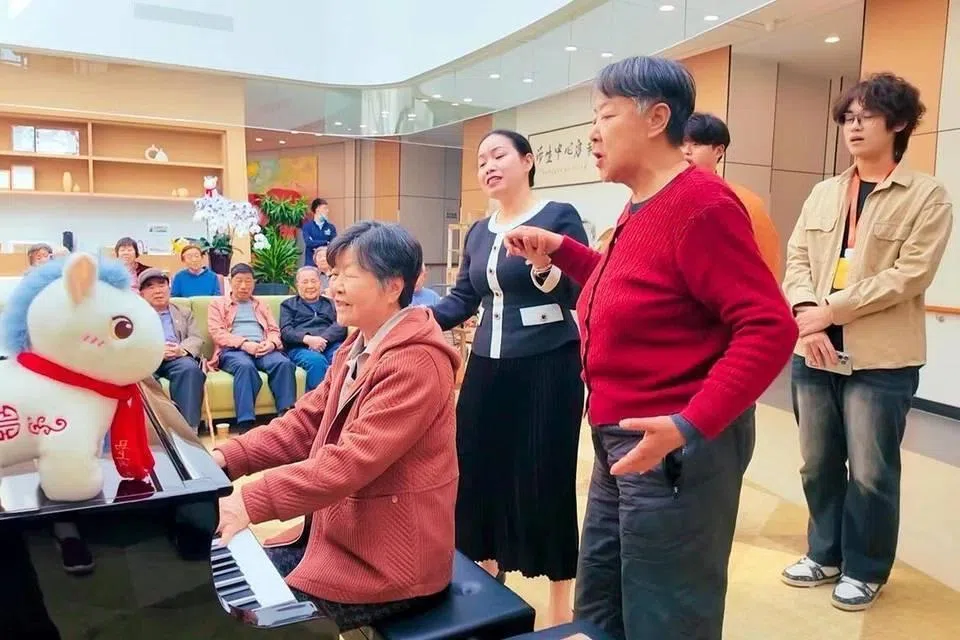 Residents and staff at Sindora Living’s senior living facility in Jinan, Shandong province. The 530-bed facility offers a range of activities, including literary salons and excursions.