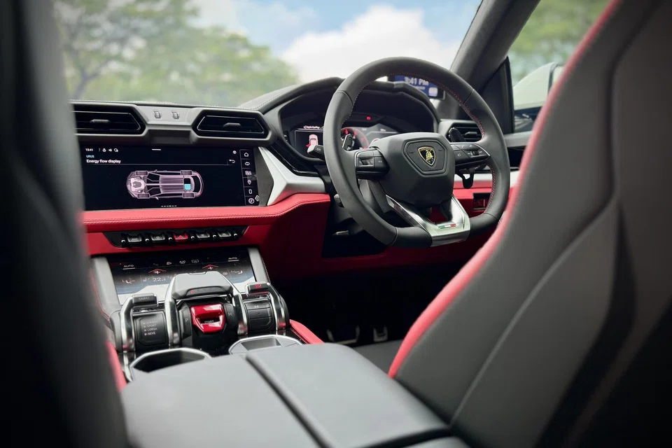 The steering wheel, buttons and even the standalone air-con screen reveal the car's Audi DNA.