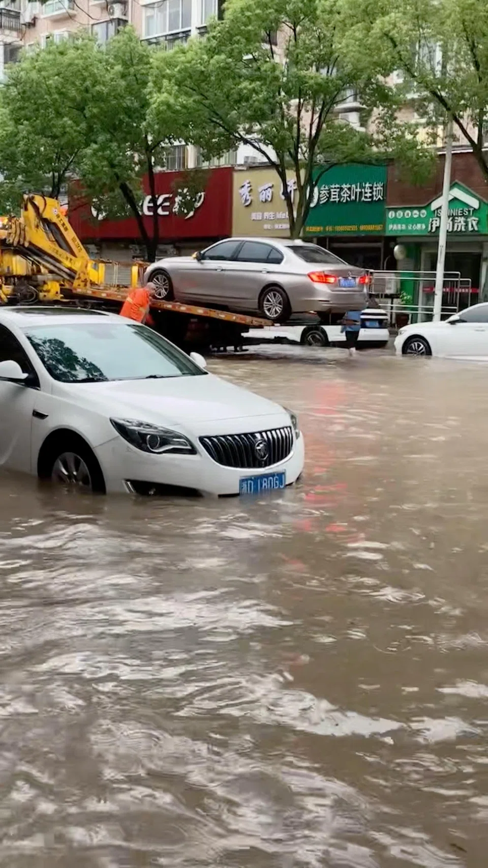 In September, the financial hub of Shanghai (top) was brought to a standstill by Typhoon Bebinca, the most powerful tropical cyclone to directly hit the city in 70 years.