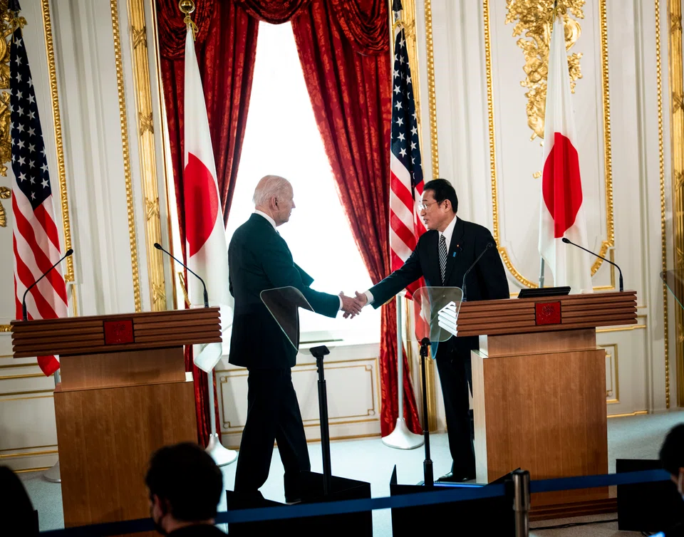 US President Joe Biden shakes hands with Japanese Prime Minister Fumio Kishida at the Akasaka Palace in Tokyo on May 23, 2022. The leaders of Japan, India, Australia and the United States will meet in Tokyo on Tuesday seeking common ground on countering China.