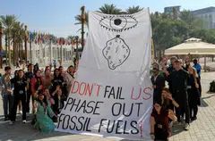 Climate activists pushing for an end to fossil fuels at the COP 28 climate summit. Negotiators from nearly 200 countries at the summit are attempting to agree on a deal to limit climate change.