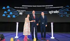 Piyush Gupta (centre), chairman of the Association of Banks in Singapore (ABS); Ong-Ang Ai Boon (left), director of ABS; and Tan Chin Hwee, chairman of SGTraDex, commemorate the collaboration between Trade Finance Registry and SGTraDex on the bill of lading genuineness check at the ABS Chinese New Year lunch on Feb 12.