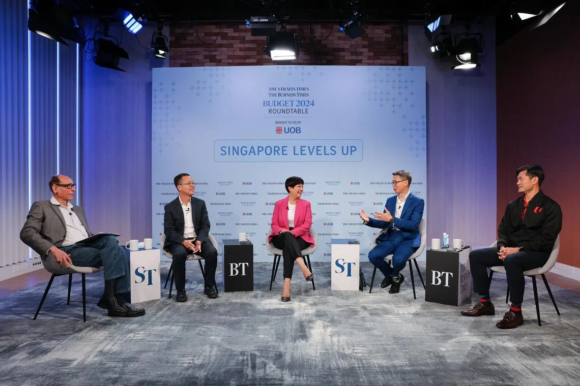 From left: ST associate editor Vikram Khanna; UOB senior economist Alvin Liew; Second Minister for Finance and National Development Indranee Rajah; ASME President Ang Yuit; and NTUC deputy secretary general Desmond Tan.