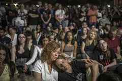 People attend a vigil on the eve of the anniversary of the Hamas attacks in Tel Aviv, Israel, Oct 6, 2024. 