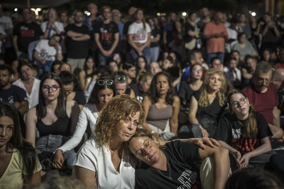 People attend a vigil on the eve of the anniversary of the Hamas attacks in Tel Aviv, Israel, Oct 6, 2024. 
