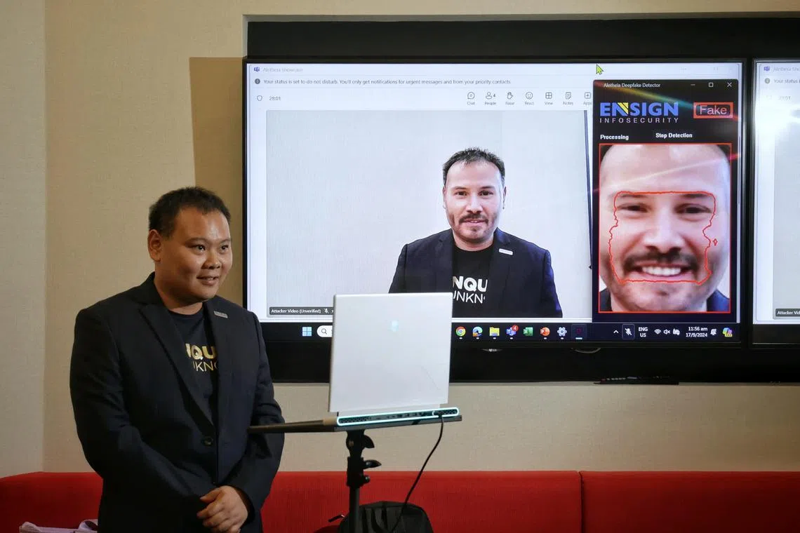 Ensign Labs vice-president of machine learning and cloud research Lee Joon Sern demonstrating the use of Aletheia, a real-time deepfake detection solution developed by Ensign.