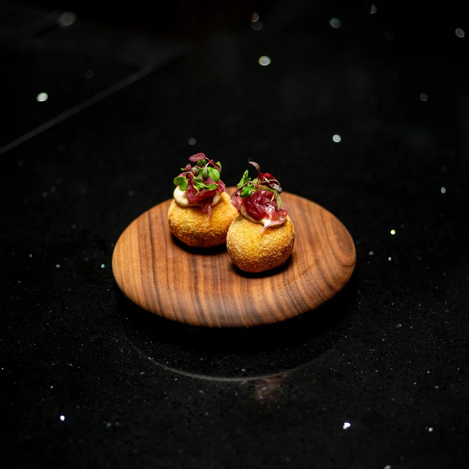 Brandade croquettes are lightly fried balls of mashed potato and cod.