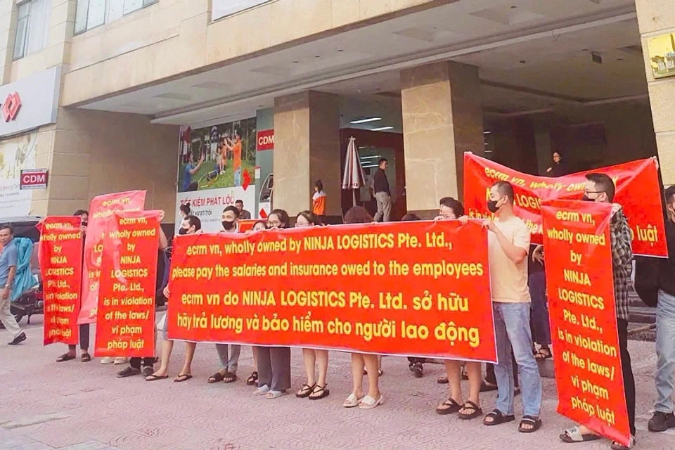 Workers at ECRM Nobita protesting outside a company office on Sep 12, saying they were owed wages and social insurance contributions. 