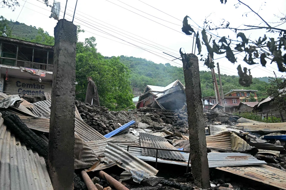 A local resident inspects the debris of his house that was destroyed by Pakistani artillery shelling at the Lagama village in Uri, India, May 9, 2025. 