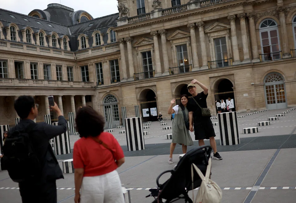 Tourists at the Palais Royal in Paris. Asian visitors prefer to combine their sports viewing with broader travel plans and, on average, book longer hotel stays than Europeans, says online platform Trip.com. 