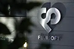KKR increased its tender offer for Fuji Soft to 9,850 yen per share, putting it above the 9,600 yen per share that Bain Capital said it planned to offer.