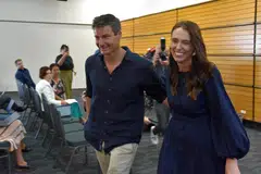 New Zealand Prime Minister Jacinda Ardern leaving with longtime partner Clarke Gayford following the announcement of her resignation at the War Memorial Hall, in Napier on Jan 19.  