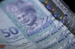 The Malaysian ringgit climbed more than 1 per cent on Friday to the highest since November, the biggest gainer in Asia. 