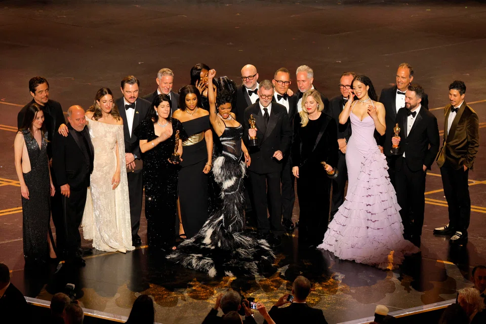 Director Paul Thomas Anderson and cast members celebrate as they accept the Oscar for Best Picture for "One Battle after Another" at the 98th Academy Awards.