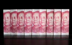 IMF officials say the country’s low inflation relative to price levels among its trading partners has led to a weaker yuan in real terms.