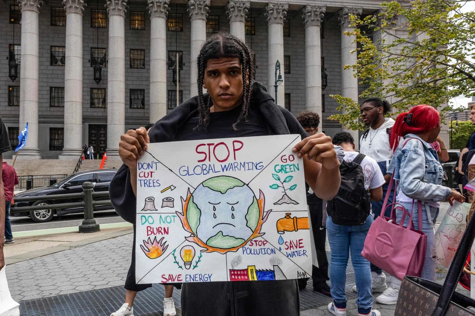 A young climate activist at a demonstration in New York City on Sep 20. Businesses that invest in the next generation through capacity-building and bringing youth to the brainstorming and decision-making table will gain hugely, says the writer. 