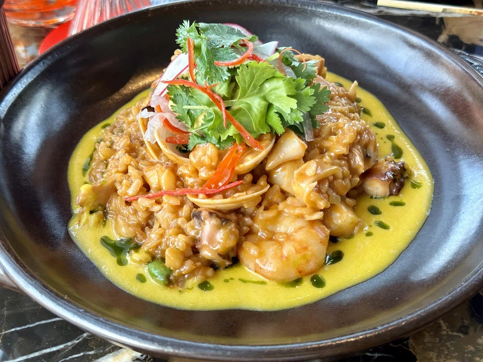 Seafood cazuela rice features al dente rice cooked in a Peruvian yellow-pepper sauce.
