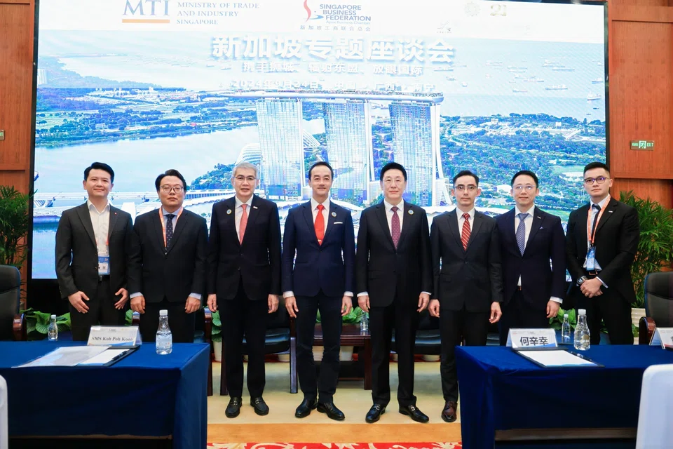From left: Ng Yan Chao, country head of strategy, transformation and analytics, DBS Bank (China); Philip Chong, marketing director, Singapore-Guangxi Integrated Developments; Lim Ming Yan, chairman, Singapore Business Federation; Koh Poh Koon, Senior Minister of State for Sustainability and the Environment and Manpower; He Xin Xing, Representative of Guangxi Zhuang Autonomous Region; Lee Boon Bee, managing director, OCBC China; Li Yu, CEO of international business, Singapore Post; and Charles Ye, head of commercial, PIL China.