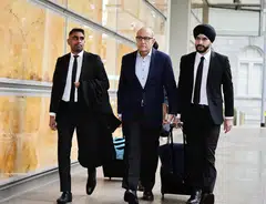 Former transport minister S Iswaran (centre) had previously faced an additional 28 counts under Section 165 as well as two charges of corruption.