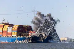 Engineers detonate controlled explosives to remove a steel span from the Key Bridge from the bow of the Dali container ship in Baltimore, Maryland, May 13, 2024. 