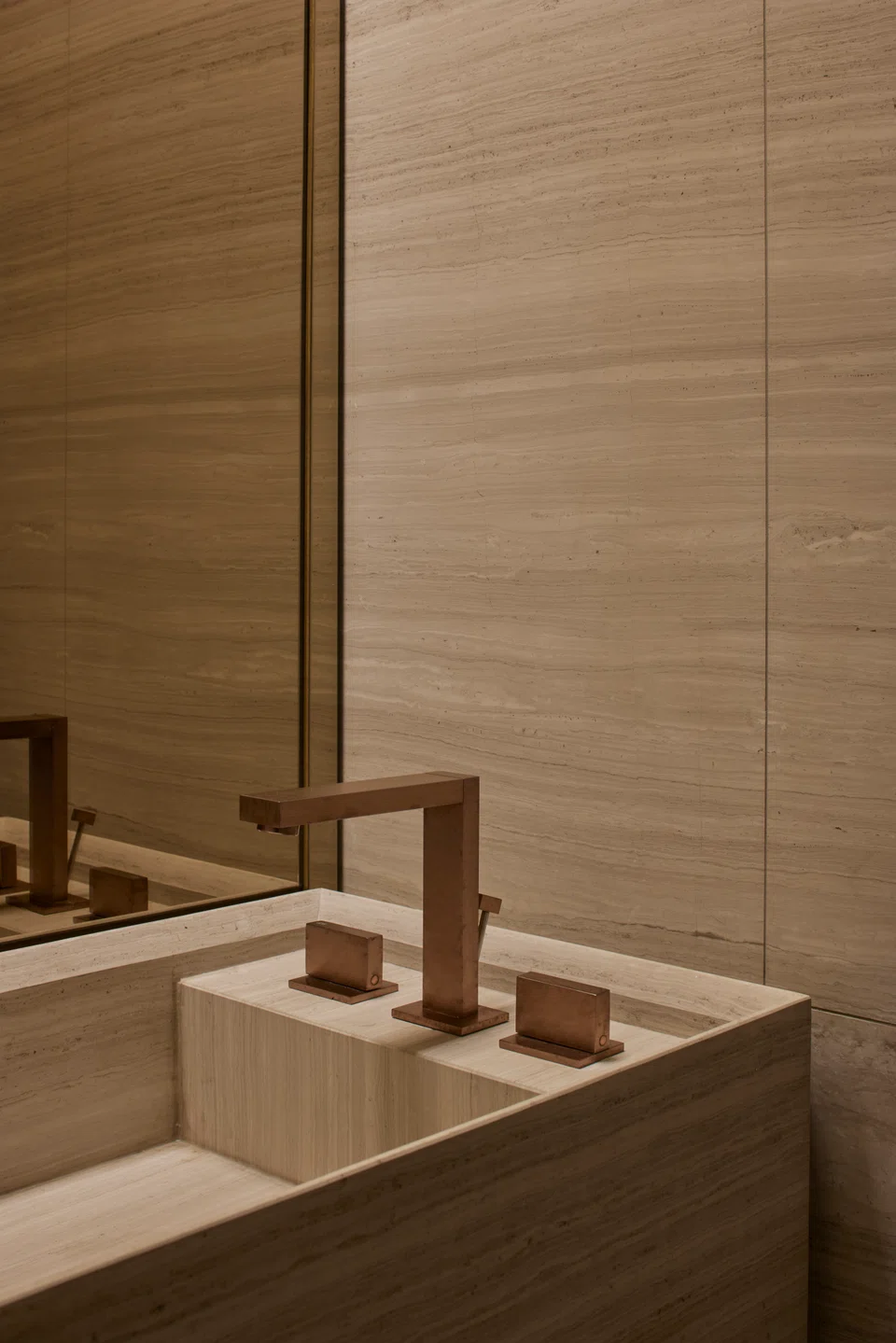 Marble from Greece wraps the master bathroom walls.