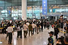South Korean workers arrive at Incheon International Airport on Sep 12, 2025 after their detention in a US immigration raid at a Hyundai-LG plant in Ellabell, Georgia. 