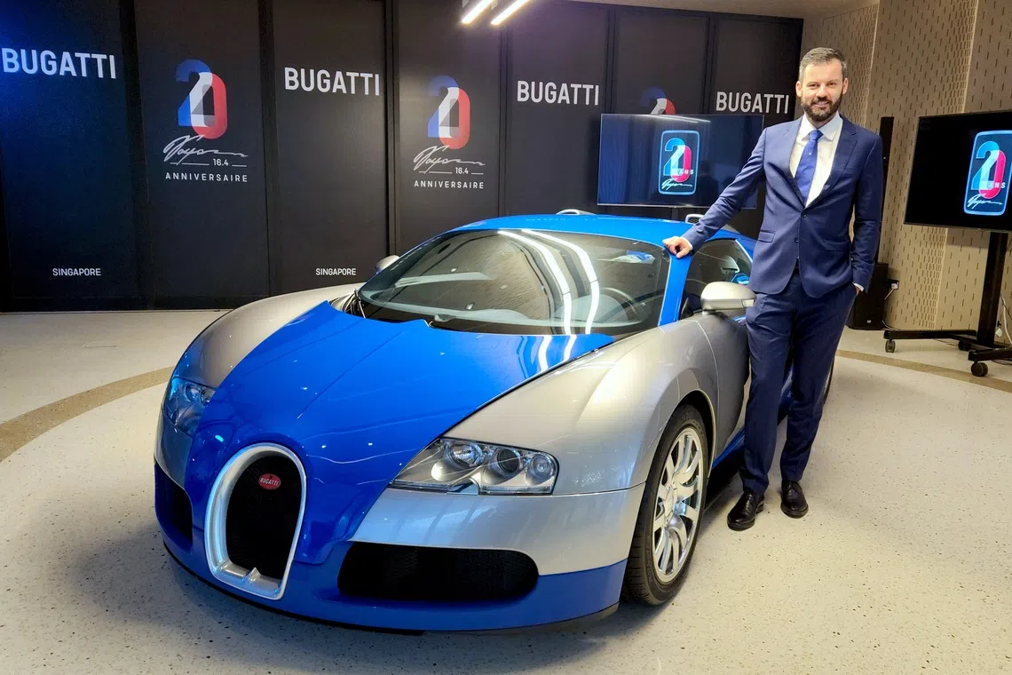 “We don’t plan to have a fully electric Bugatti at all,” says Bugatti Rimac CEO Mate Rimac, pictured here with the Bugatti Veyron hypercar.