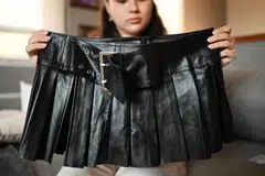 Isidora Olave, 20, showing her order from fast fashion e-commerce company Shein in Santiago, Chile, Nov 12, 2024. Ultra-cheap Chinese online shops are causing concern in Latin America because of the unfair competition they pose to traditional commerce. 