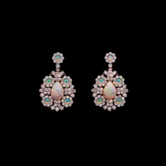 White opals are put to great effect in a pair of Les Jardins de la Couture pink gold and diamond dangle earrings from Dior. 