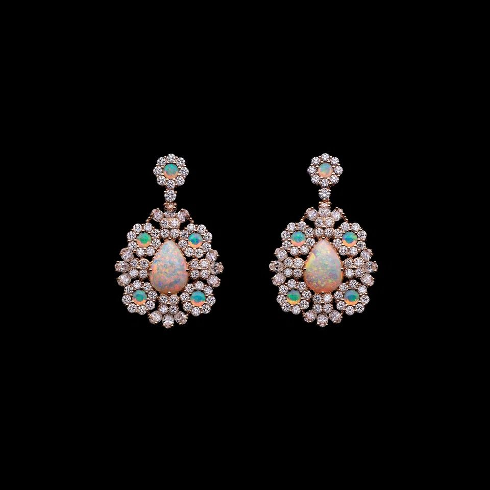 White opals are put to great effect in a pair of Les Jardins de la Couture pink gold and diamond dangle earrings from Dior. 