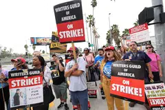 SAG-AFTRA actors and Writers Guild of America (WGA) writers walk the picket line during their ongoing strike outside Netflix offices in Los Angeles, California, Sept 22, 2023. 