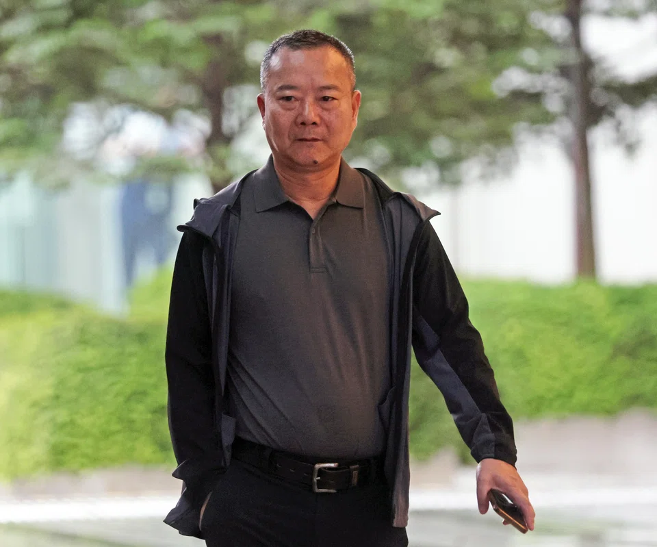 Chinese national Zhan Guotuan admits to authorising the purchase of landed properties in East Coast Road. 